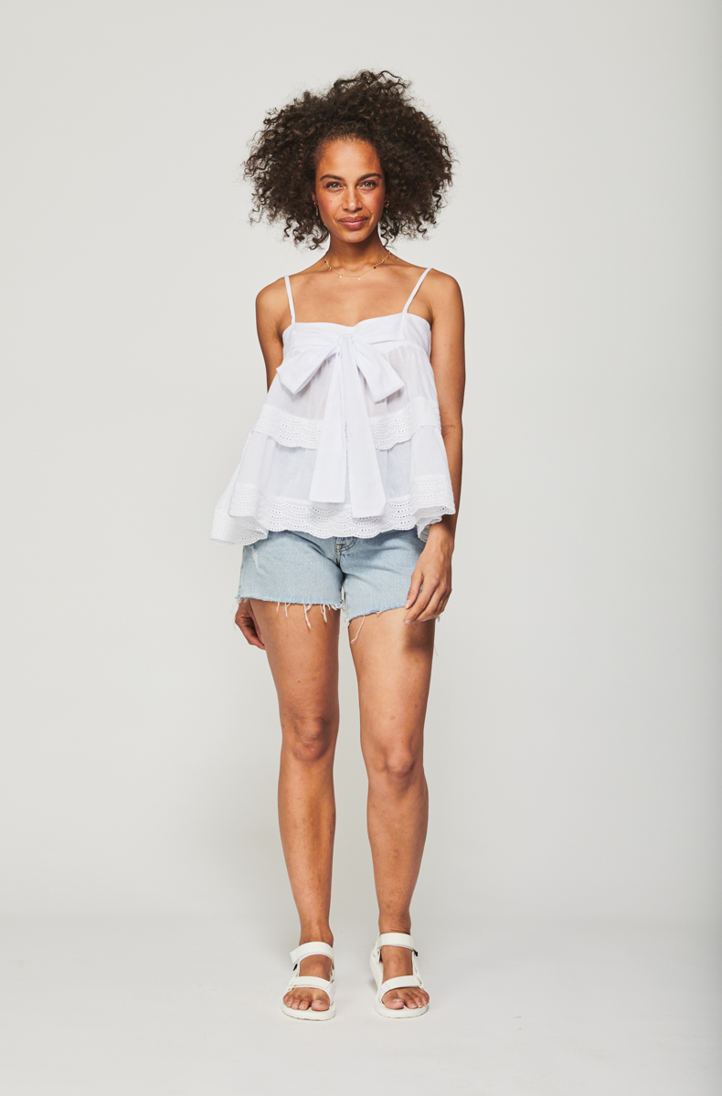 Tiered Trim Top with Bodice Tie in White; Longline distressed denim shorts | Bohemian Traders spring-summer 2020